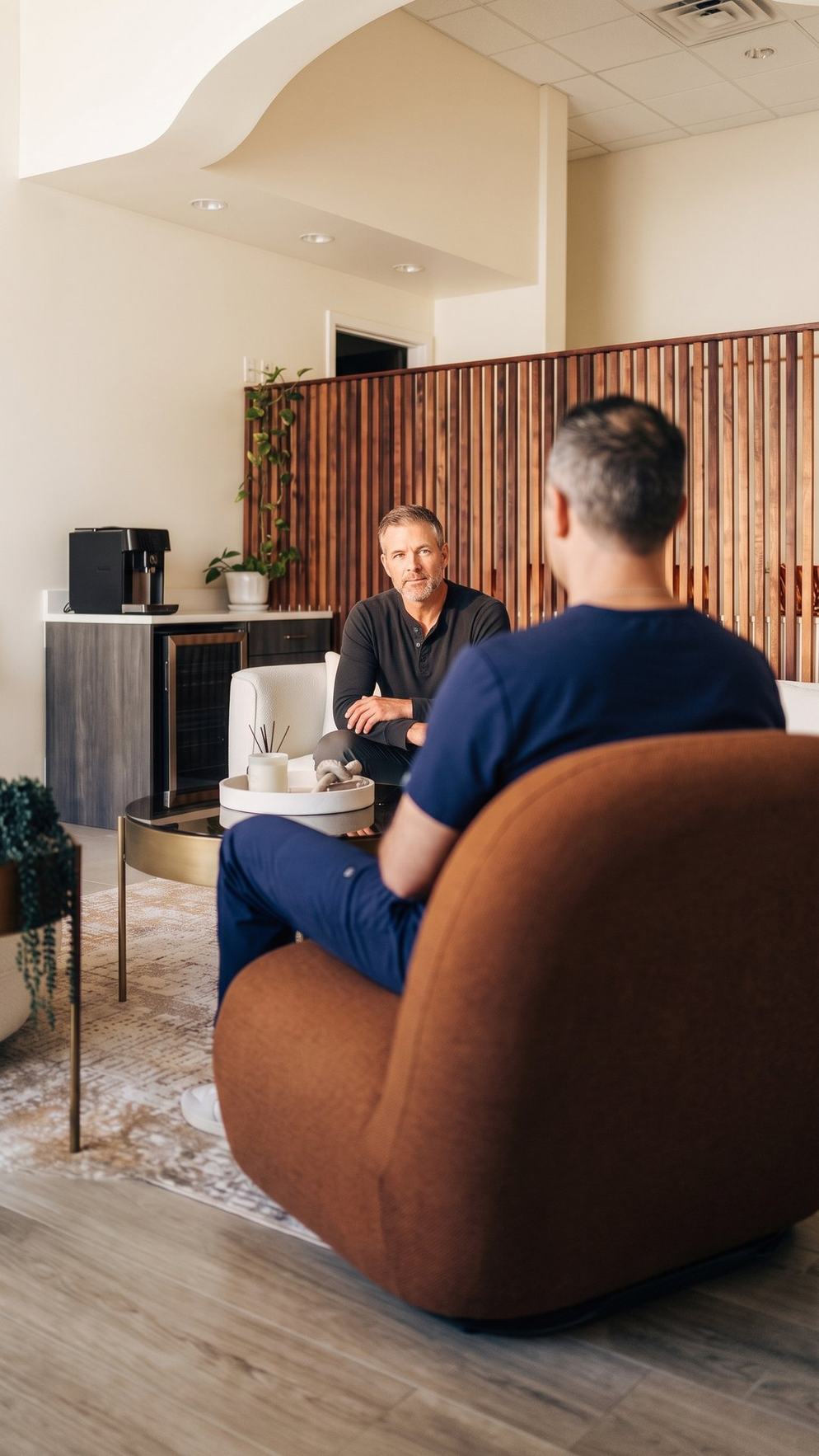 Man listening to his physician during a TRT hormone consultation